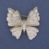 Broche-colgante Mariposa con esmalte blanco y cristales iridiscentes, metal dorado, 39x42 mm+