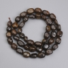 Cuentas facetadas de bronzita 6–11×5, 5–7, 5 mm ±, longitud 40 cm ± en hilo