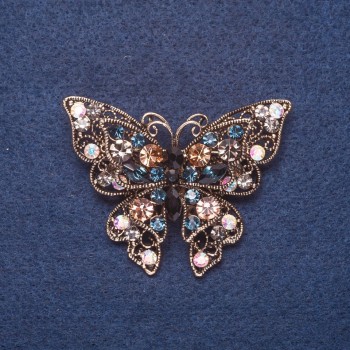 Broche 'Mariposa' con grandes cristales de strass multicolores, color dorado del metal 4x5,5 cm