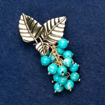 Broche con varisita «Ramita con bayas», color dorado del metal 60 × 35 mm