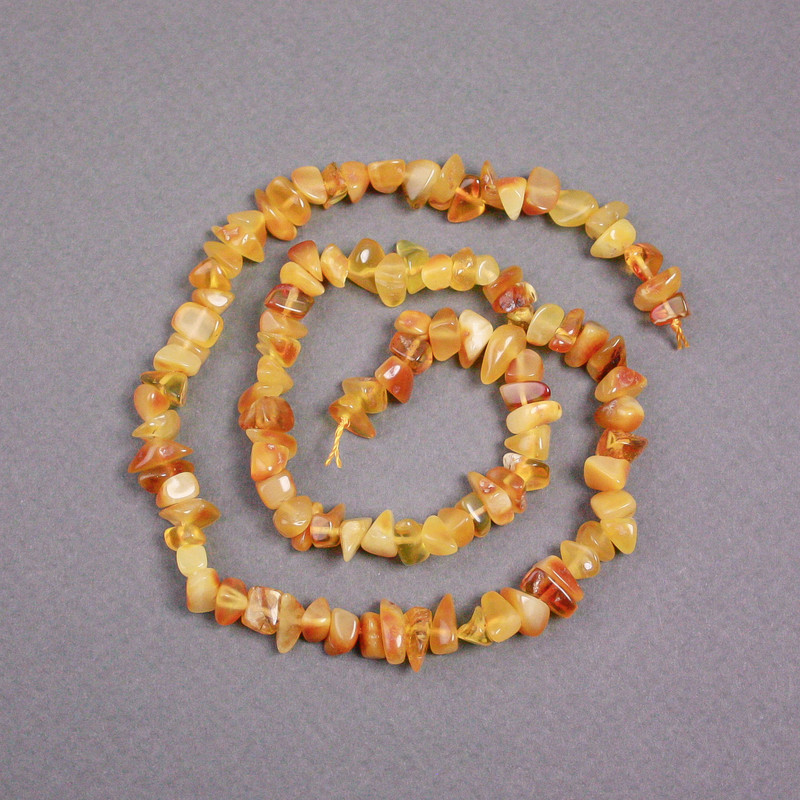 Cuentas de ámbar en hilo, trocitos 7x4 mm, longitud 39 cm ±
